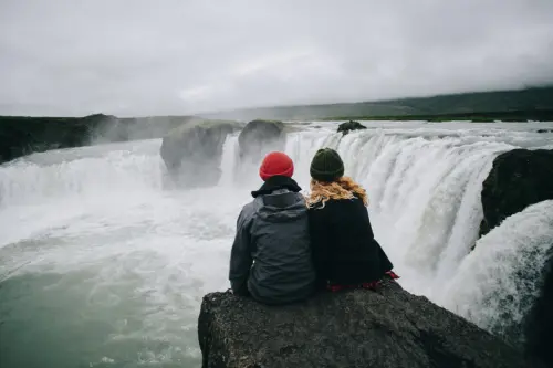 Couple looking at a powerfull waterfall